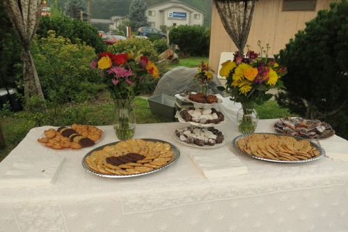 Platers of cookies and other food on a table